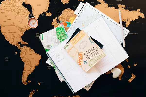 Passport, map and planner arranged for travel planning